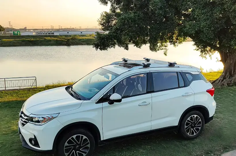 Car roof cross bars installed on a white SUV